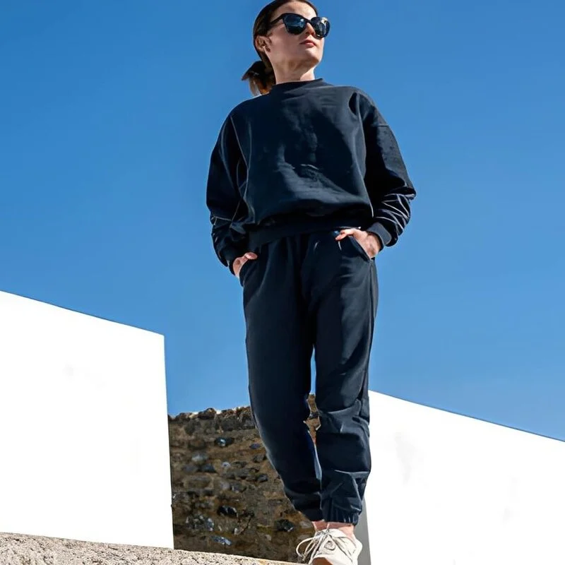 Women wear custom made black tracksuit